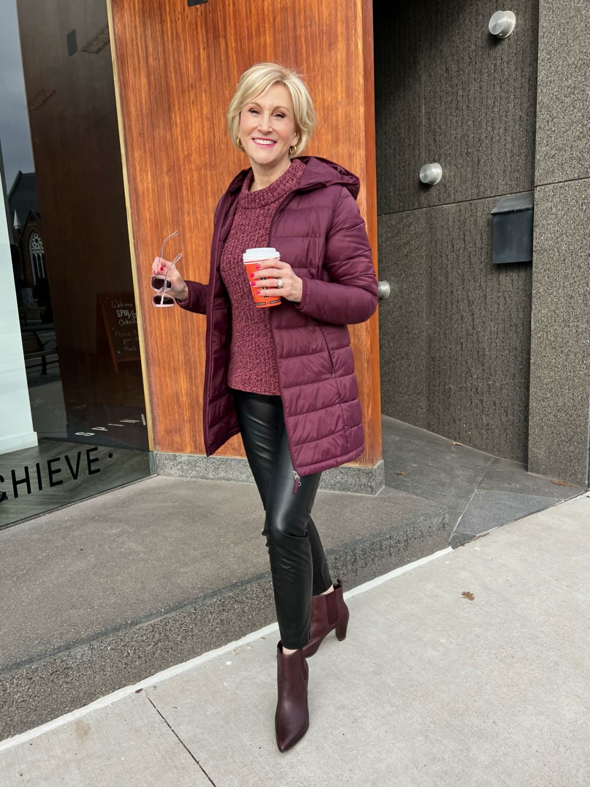 burgundy puffer jacket what to wear to a winter concert - burgundy puffer jacket, black faux leather pants