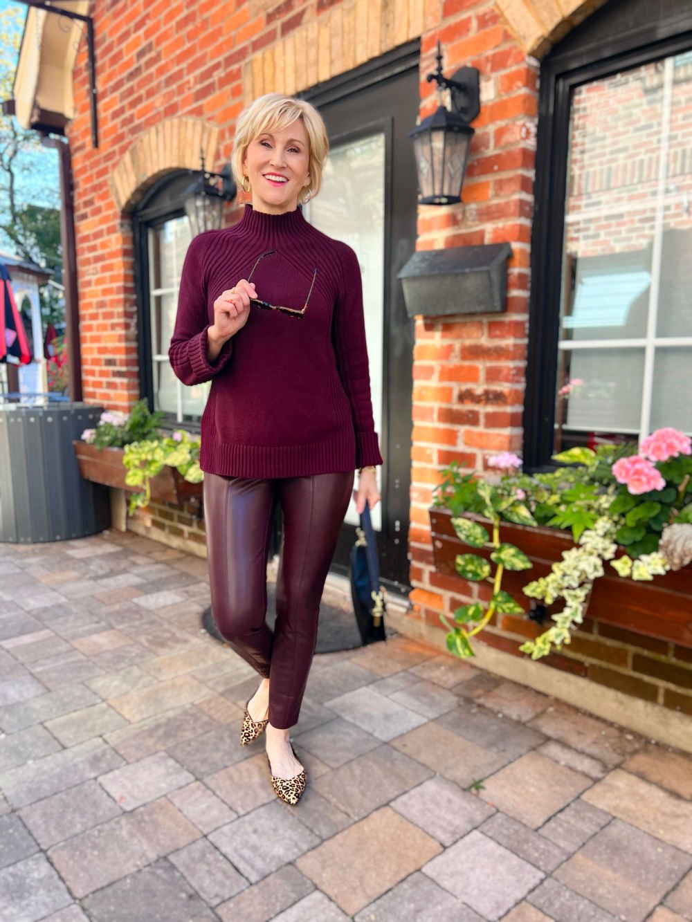 Burgundy faux leather leggings outfit with sweater