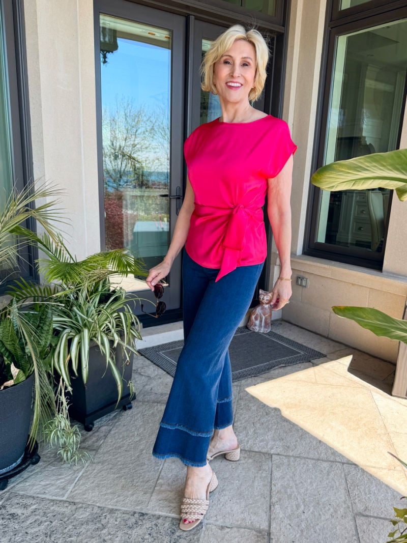 cropped wide leg frayed jeans with pink satin top