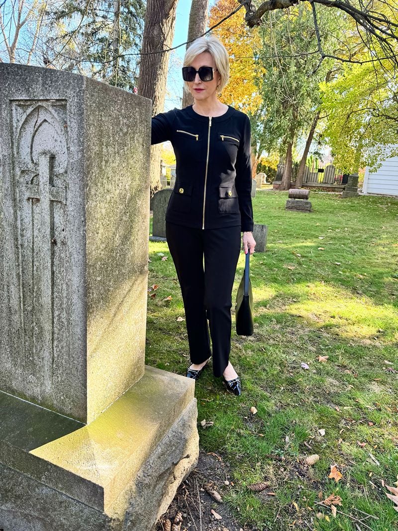 woman wearing black suit at funeral