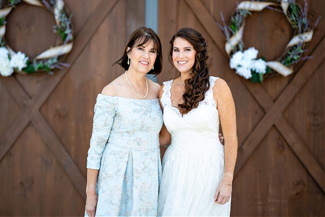 Denise-OHara Mother of the bride wearing blue dress with bride