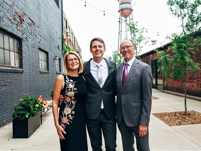 Pam-Larsen wearing navy floral Mother of the bride dress