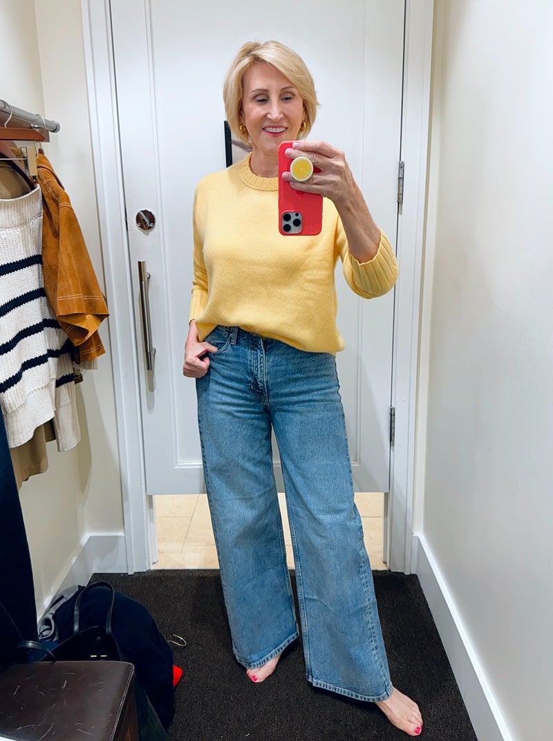 yellow cashmere crewneck sweater and wide leg jeans